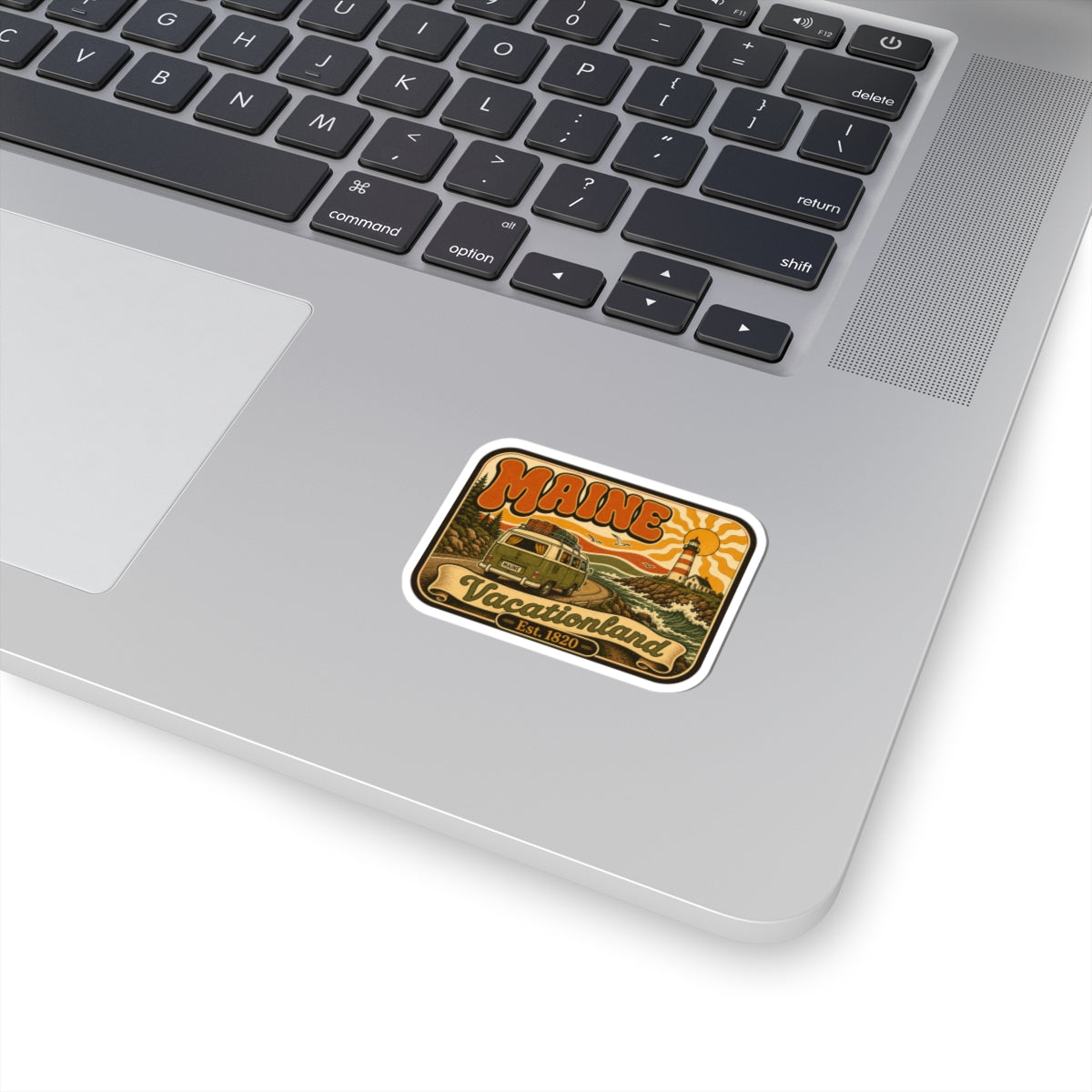 Kiss-cut Maine Vacationland sticker with retro lighthouse and sunset graphic