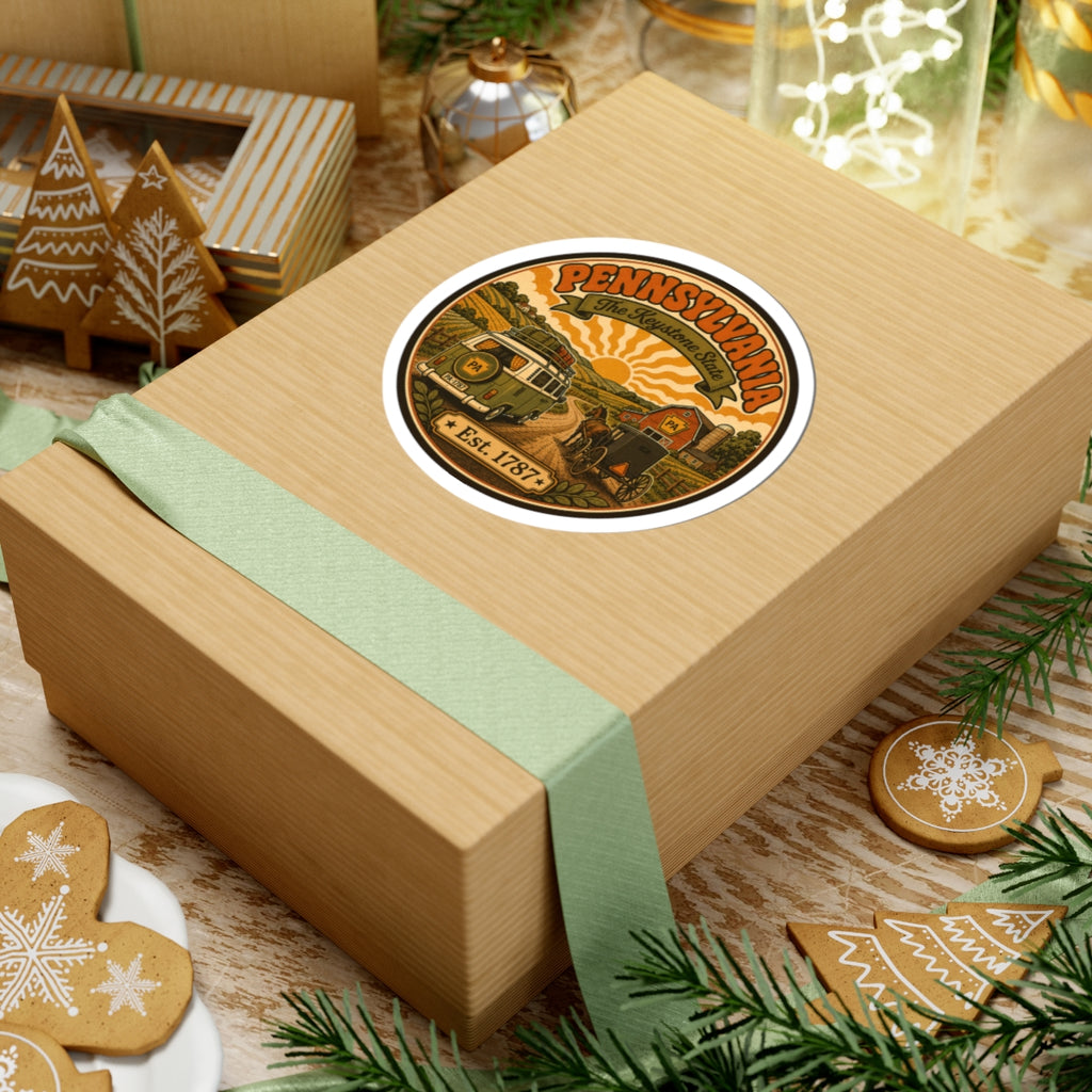 Oval Pennsylvania sticker on wrapped gift with vintage van, buggy, and Keystone banner