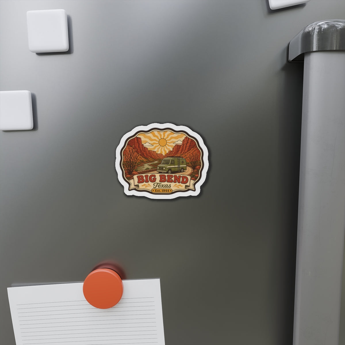 Die-cut fridge magnet on a stainless refrigerator door with desert canyon camper graphic