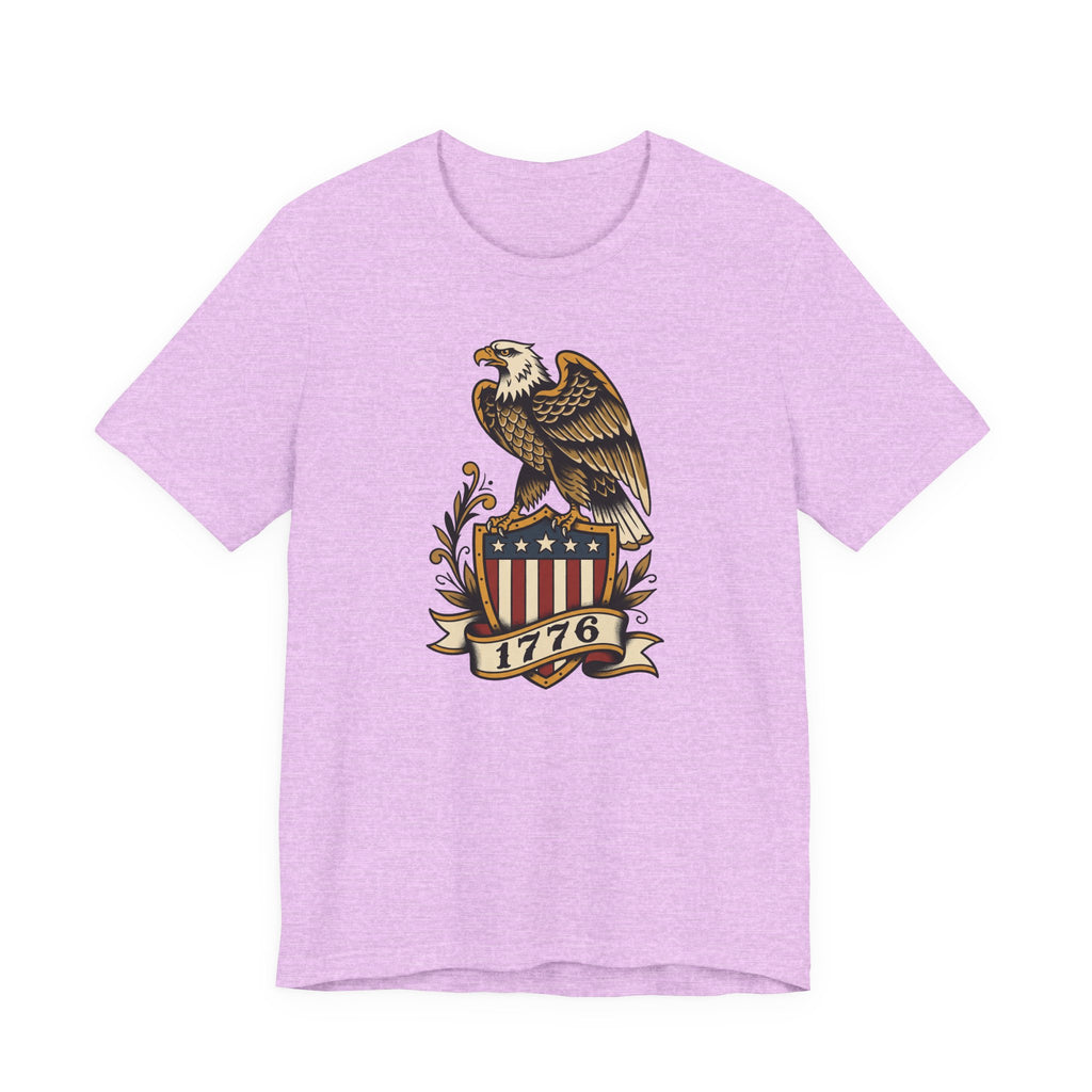 Graphic T-shirt, lavender heather, front features gold eagle and 1776 shield logo.