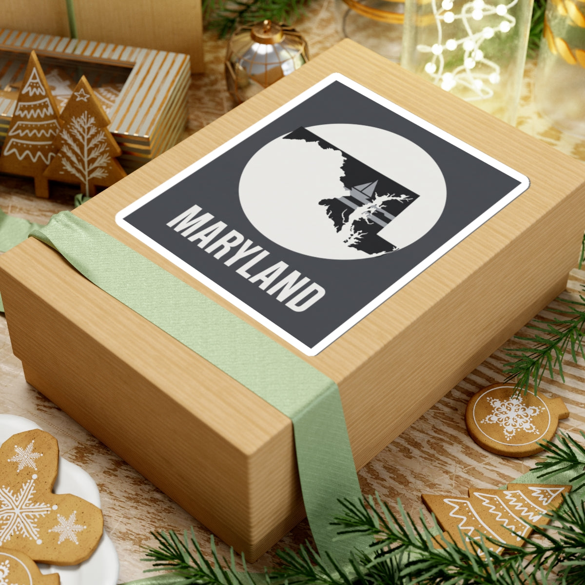 Maryland kiss-cut sticker on a gift box top, with white circle state graphic and “MARYLAND”