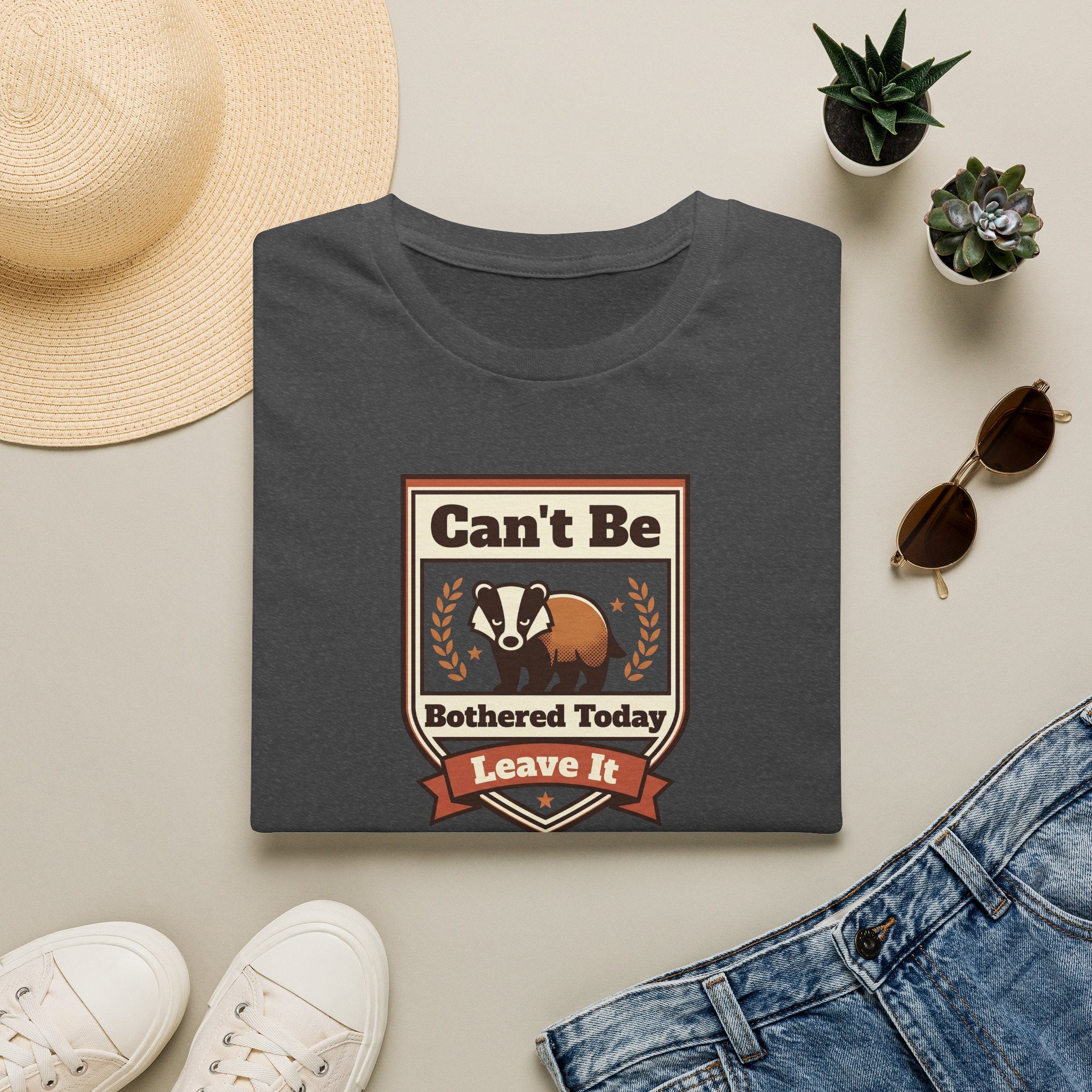 Dark gray T-shirt with crew neck and brown skunk graphic with laurel and ribbon text.
