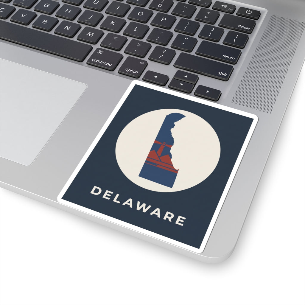 Kiss-cut Delaware sticker on laptop screen edge, blue/red state graphic in white circle