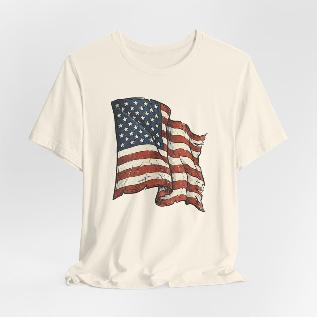 Beige T-shirt with vintage American flag waving graphic centered on chest