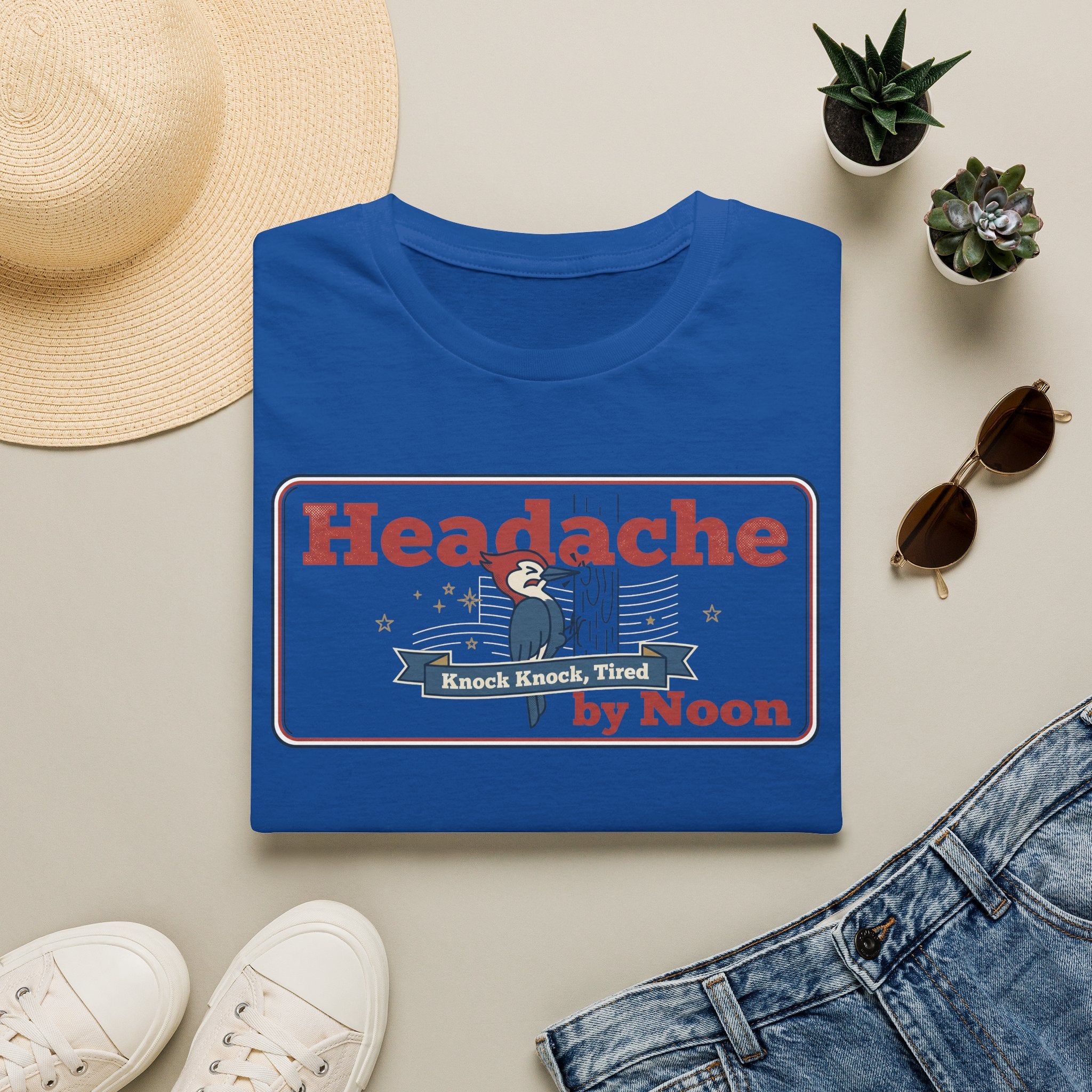 Royal blue T-shirt with “Headache” graphic and banner text in red and blue