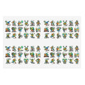 Die-cut sticker sheet with small green character icons in neat rows