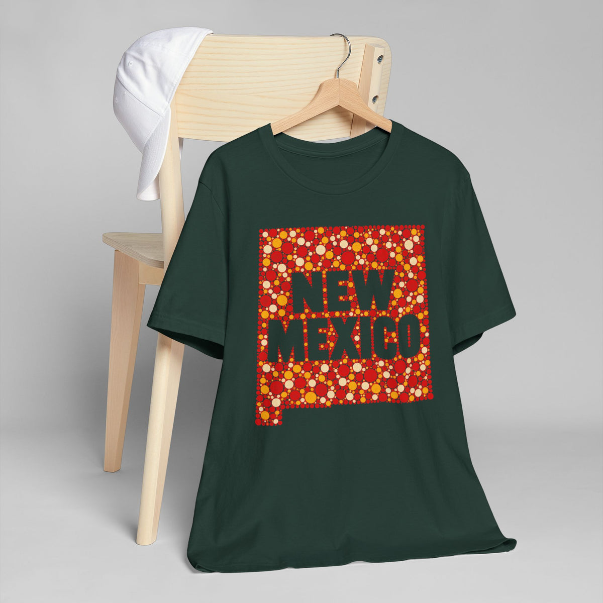 Green crew-neck T-shirt with red and yellow "NEW MEXICO" graphic
