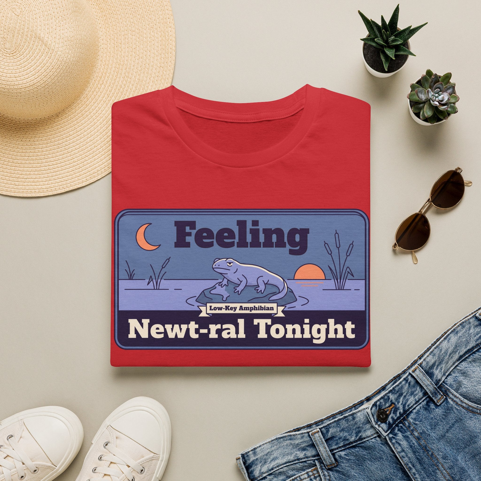 Red unisex graphic t-shirt with cartoon newt scene and “Newt-ral Tonight” text