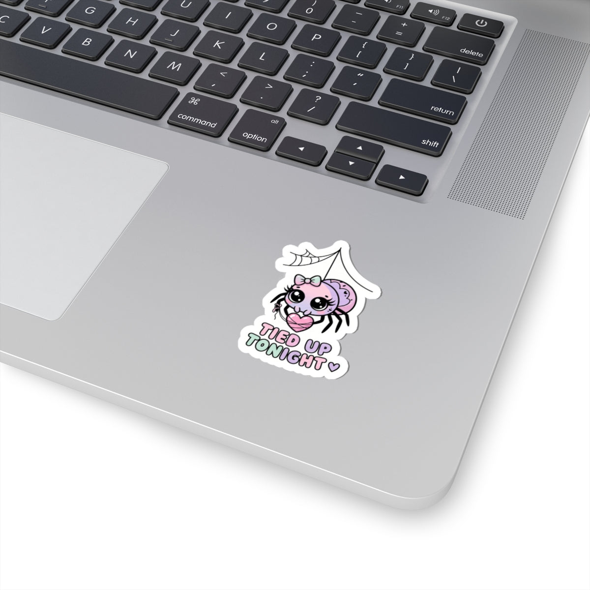 Cartoon pink spider sticker with “Tied Up Tonight” text