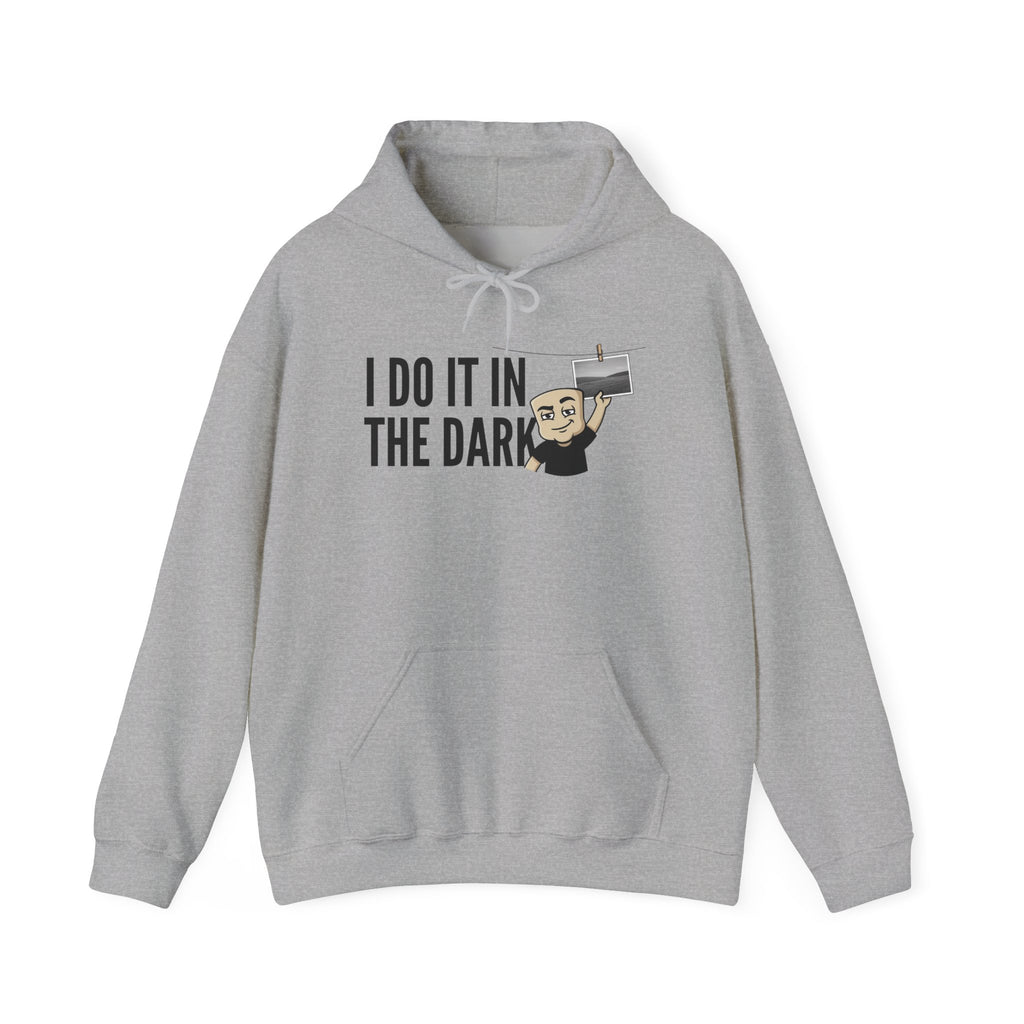 Light gray hoodie with front pocket and drawstring, 'I DO IT IN THE DARK' graphic