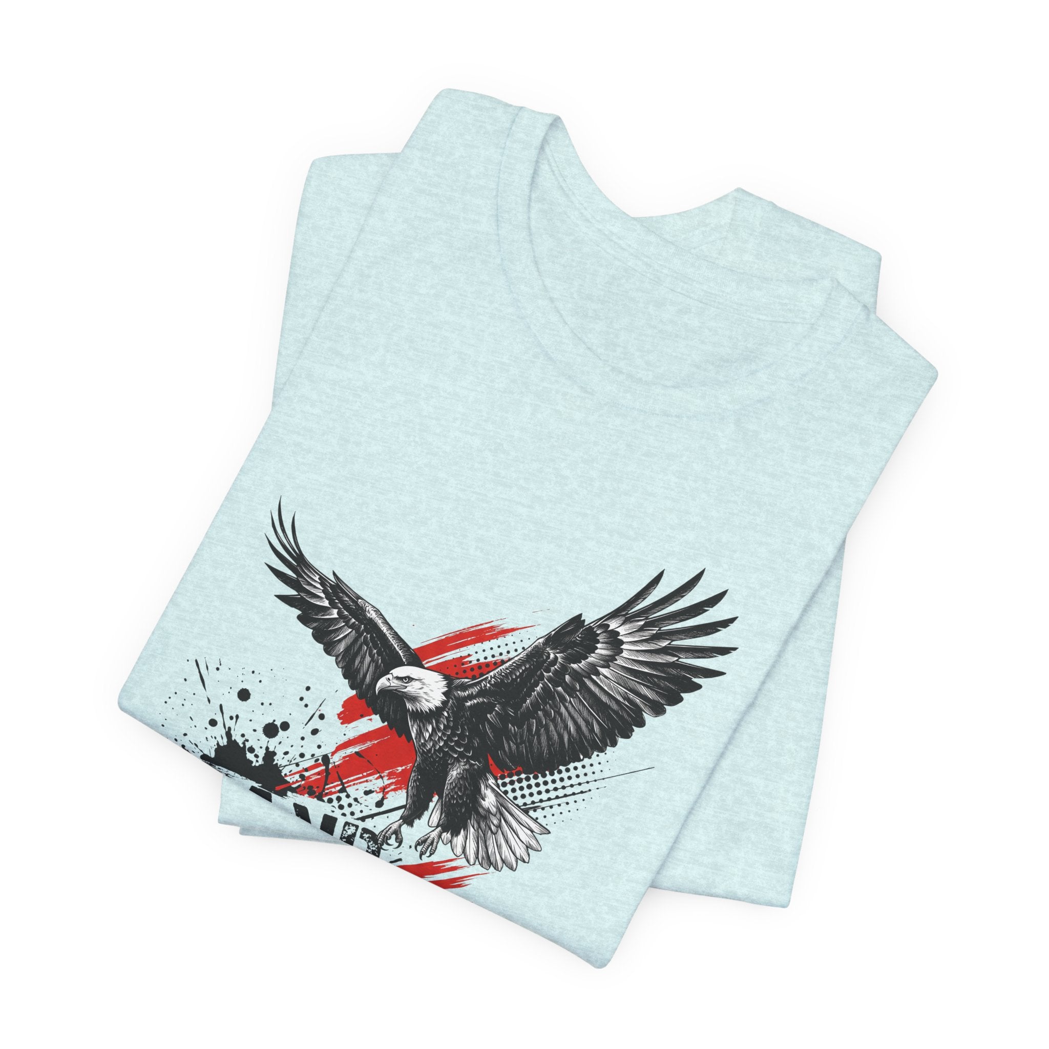 Light blue graphic t-shirt with flying black eagle over distressed red-white-blue splash.