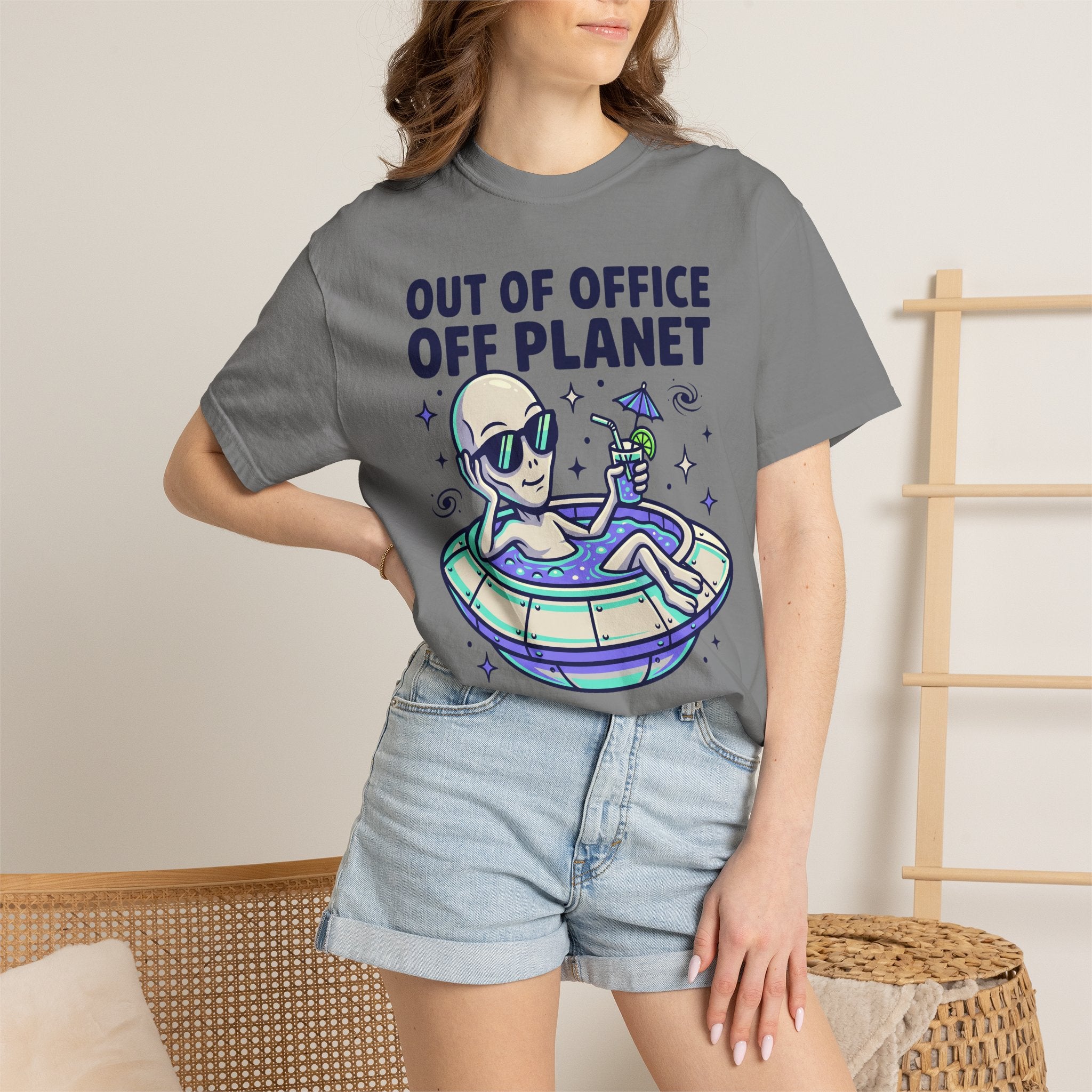 Gray graphic T-shirt worn by model with alien floatie illustration