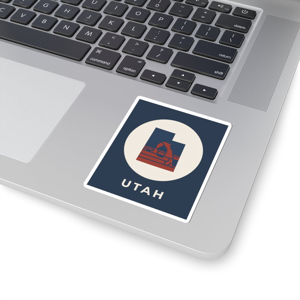 Navy Utah arch sticker with white circle and red arch graphic, "UTAH" text on border