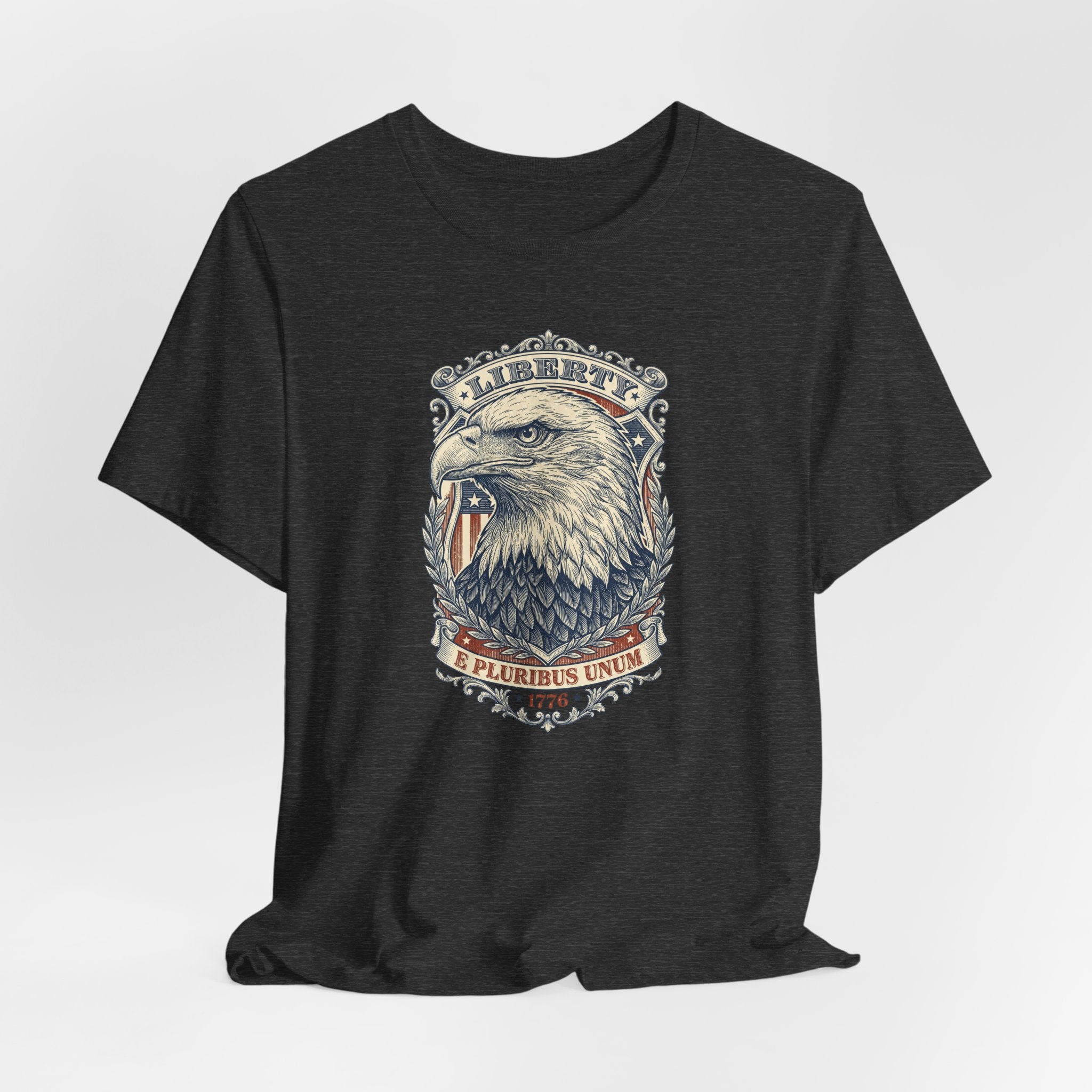 Black crewneck t-shirt with eagle head graphic and emblem at center front.