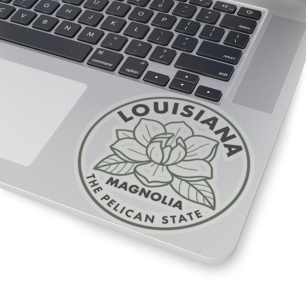 Transparent vinyl round Louisiana magnolia sticker on laptop lid, gray magnolia with pelican state