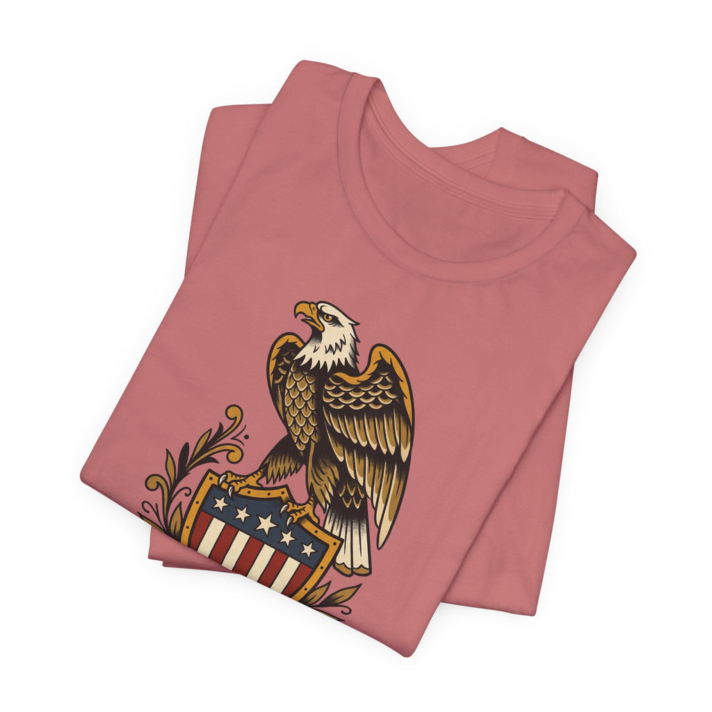 Dusty rose crew-neck T-shirt with bald eagle shield graphic on front.
