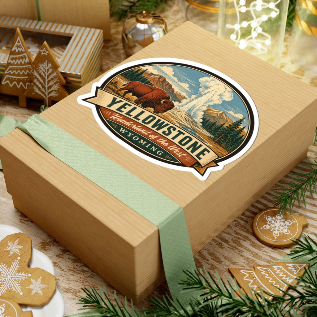Yellowstone travel sticker on a gift box top; bison, geyser plume, and Wyoming banner