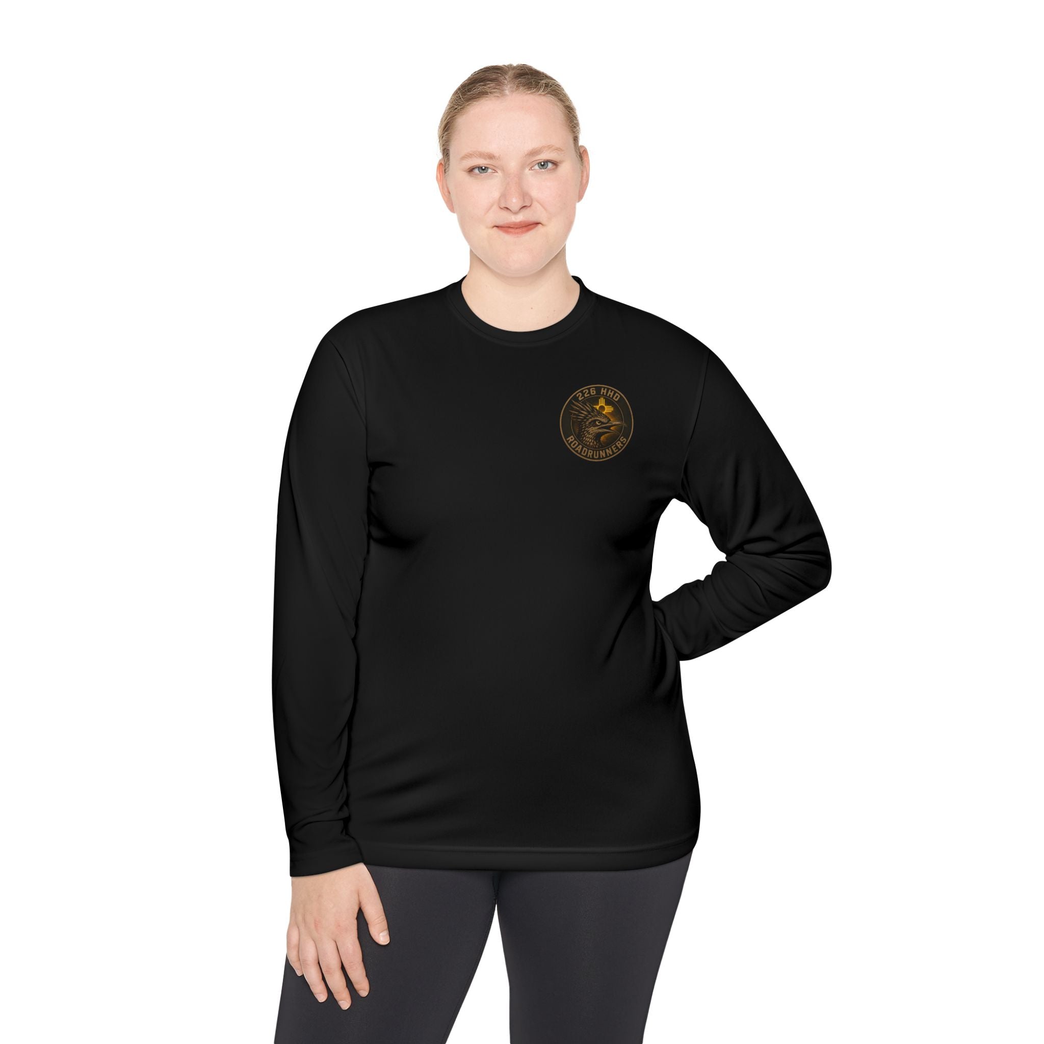 Black long-sleeve polyester tee with round chest emblem, model view