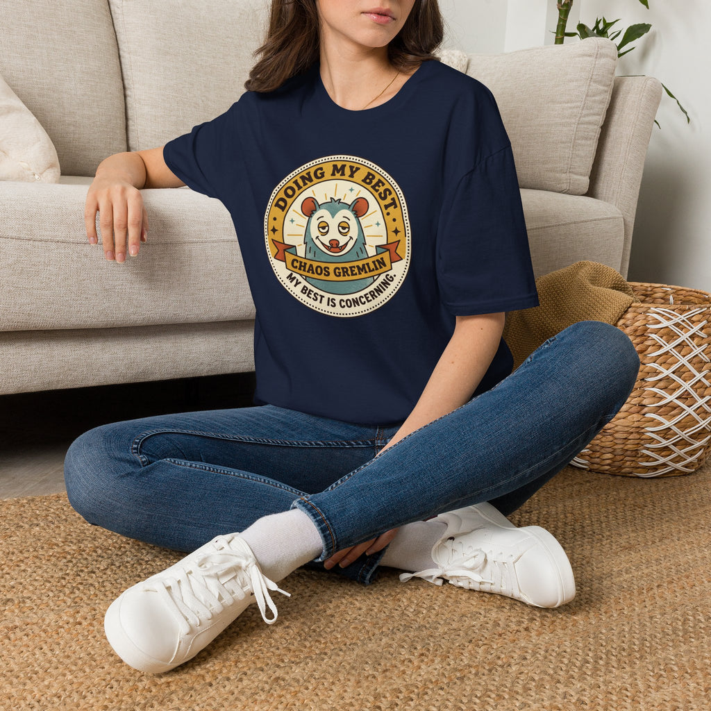 Navy T-shirt with round 'Doing My Best Chaos Gremlin' cartoon badge on chest