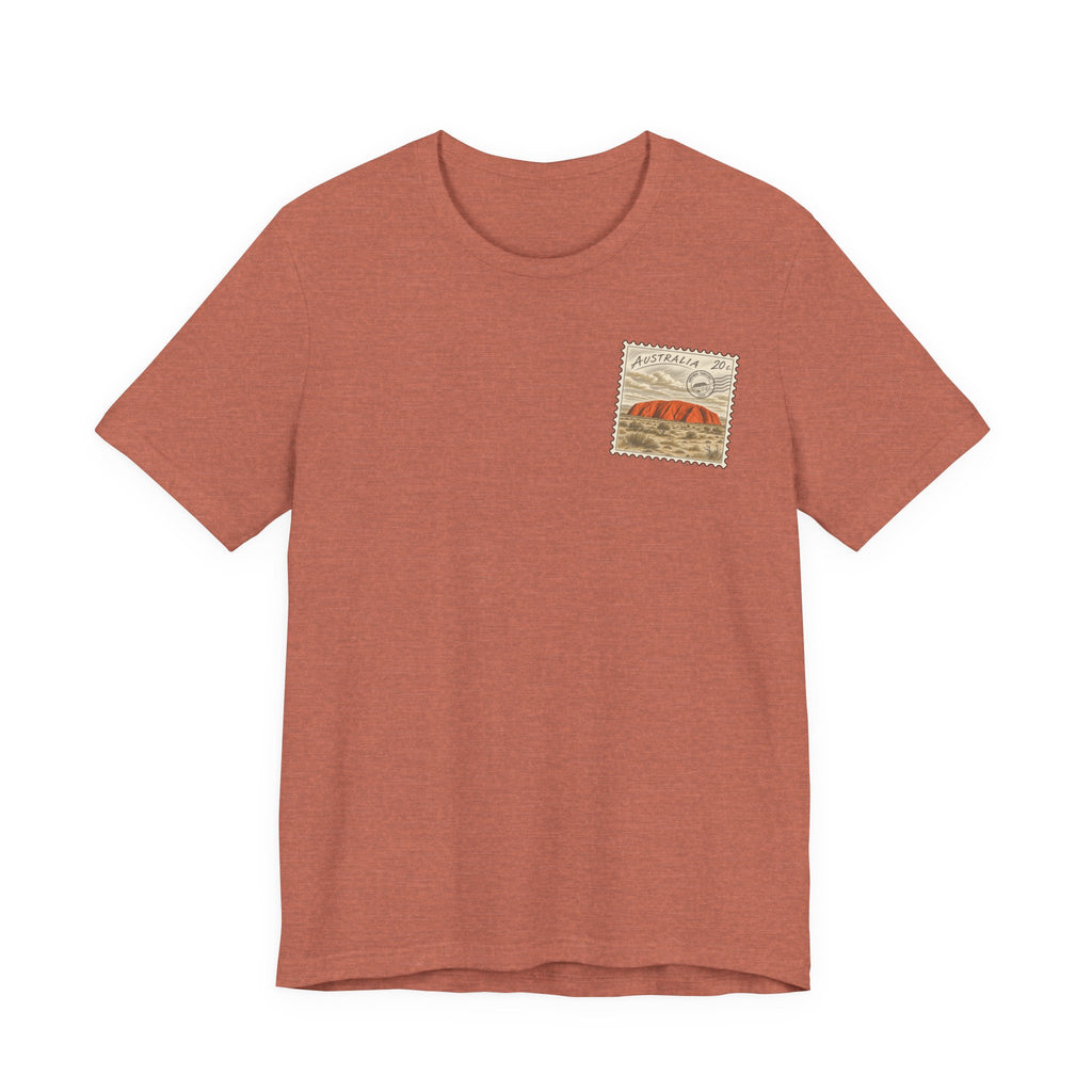 Rust brown t-shirt with small vintage postage-stamp style graphic on the chest