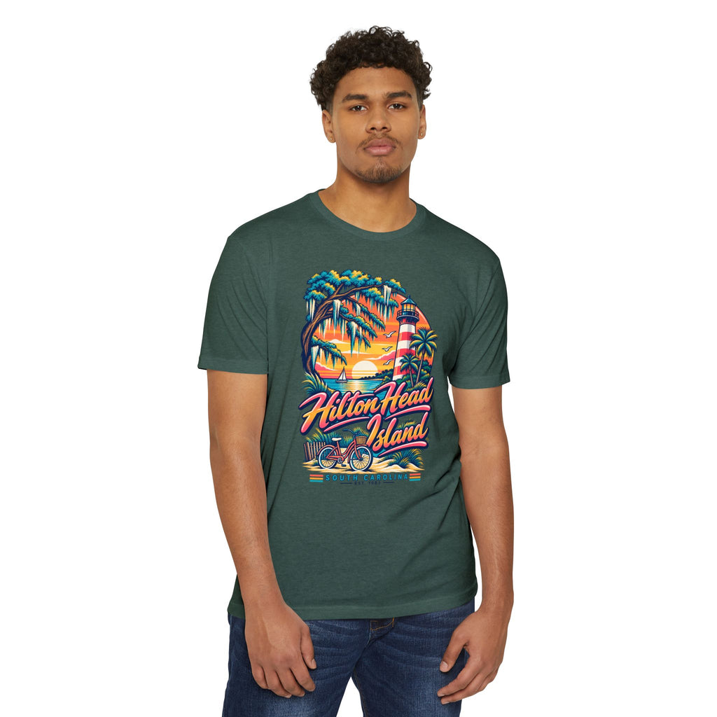 Dark green T-shirt worn by a model with colorful lighthouse, palm trees, and bicycle print
