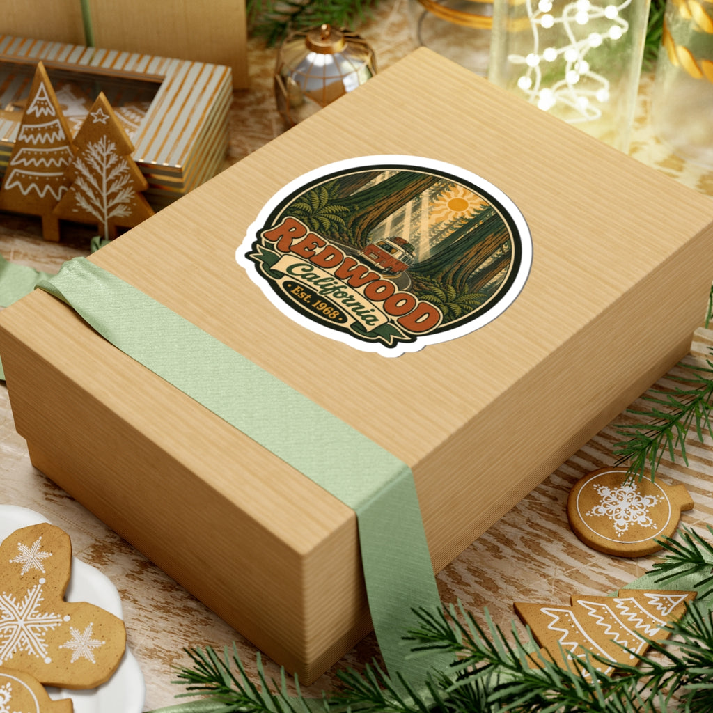 Round sticker with redwood forest illustration, camper van, “Redwood California,” and “Est. 1968.”