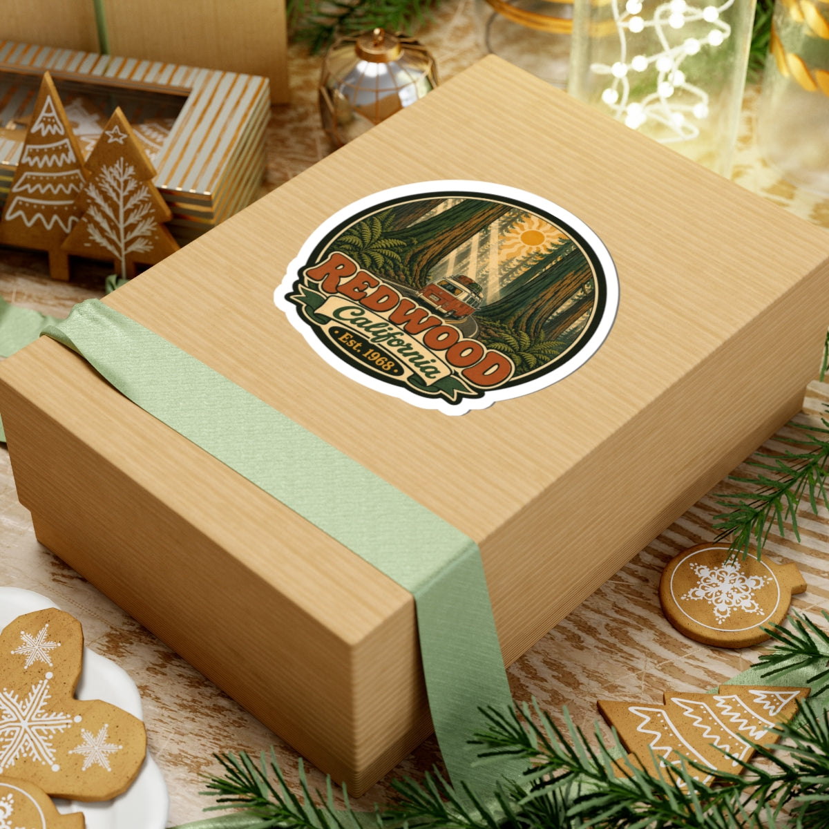 Round sticker with redwood forest illustration, camper van, “Redwood California,” and “Est. 1968.”