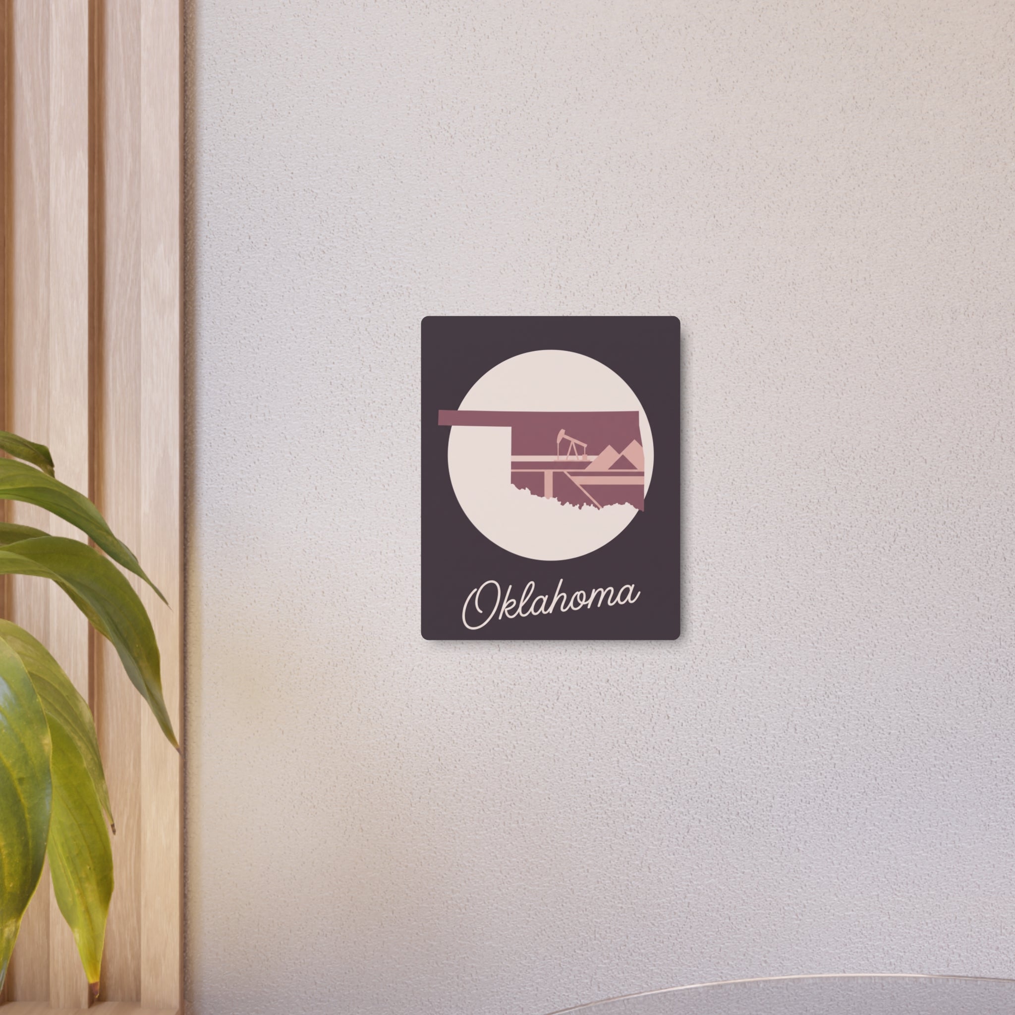 Small mauve Oklahoma metal wall art sign with circular graphic and “Oklahoma” script