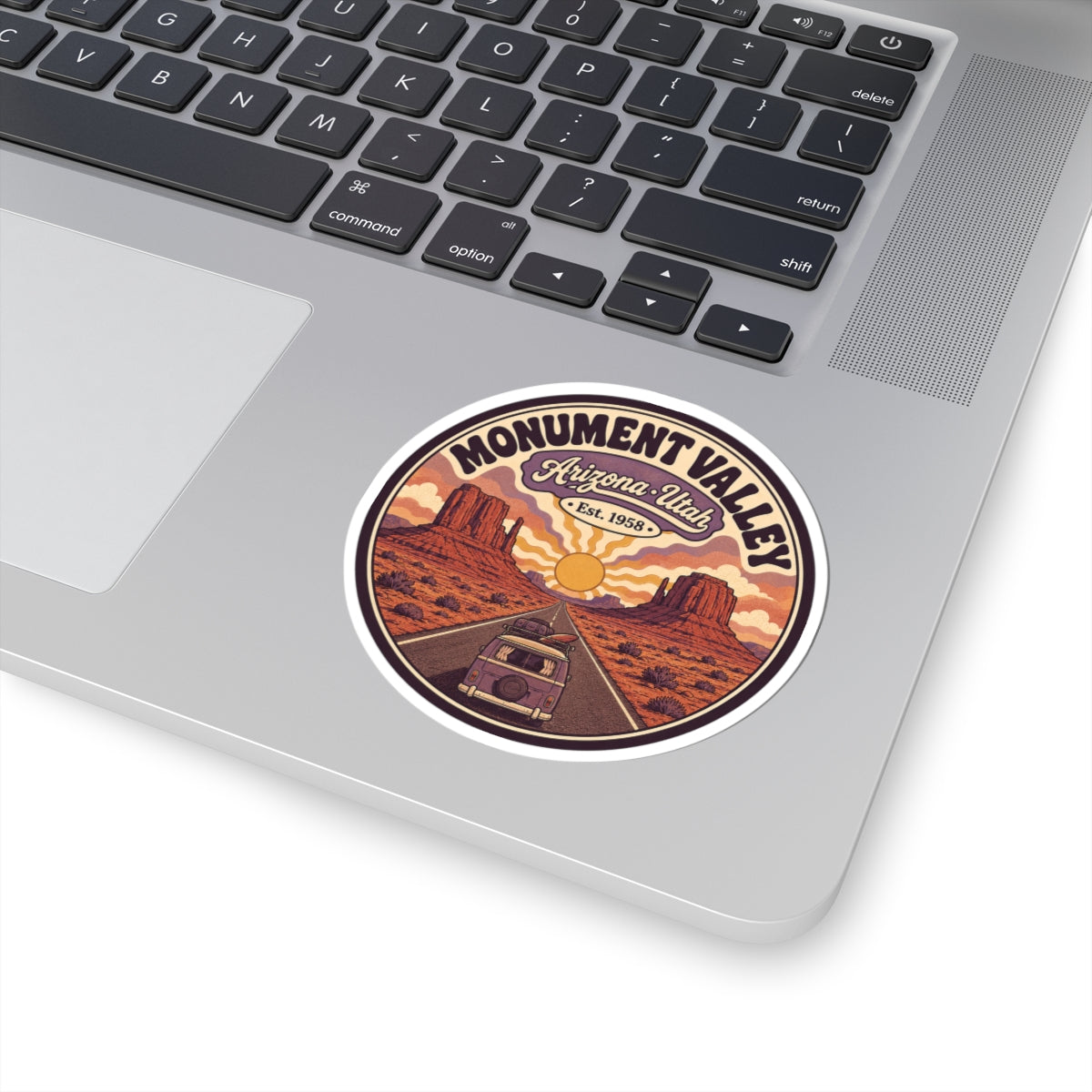 Round vintage Monument Valley sticker with Arizona-Utah banner, Est. 1958, and camper van
