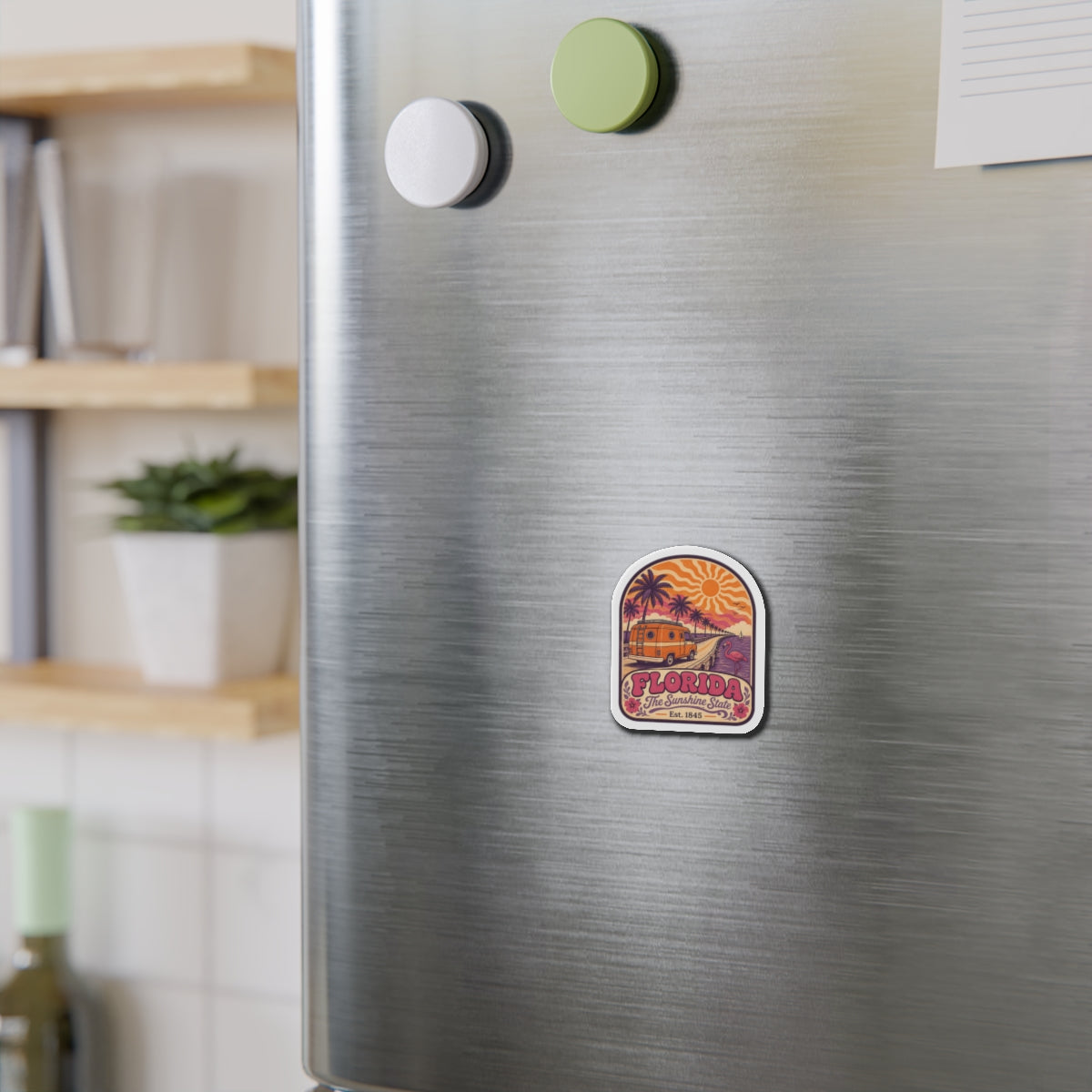 Small Florida die-cut magnet on brushed stainless fridge surface