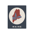 Maine state silhouette metal art sign with circular badge, pine tree graphic, and “MAINE”