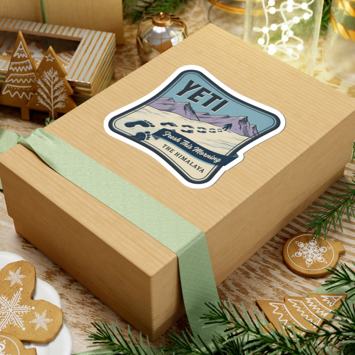 Vinyl sticker on a wrapped gift showing YETI, Himalayan peaks, paw prints, and “The Himalaya”