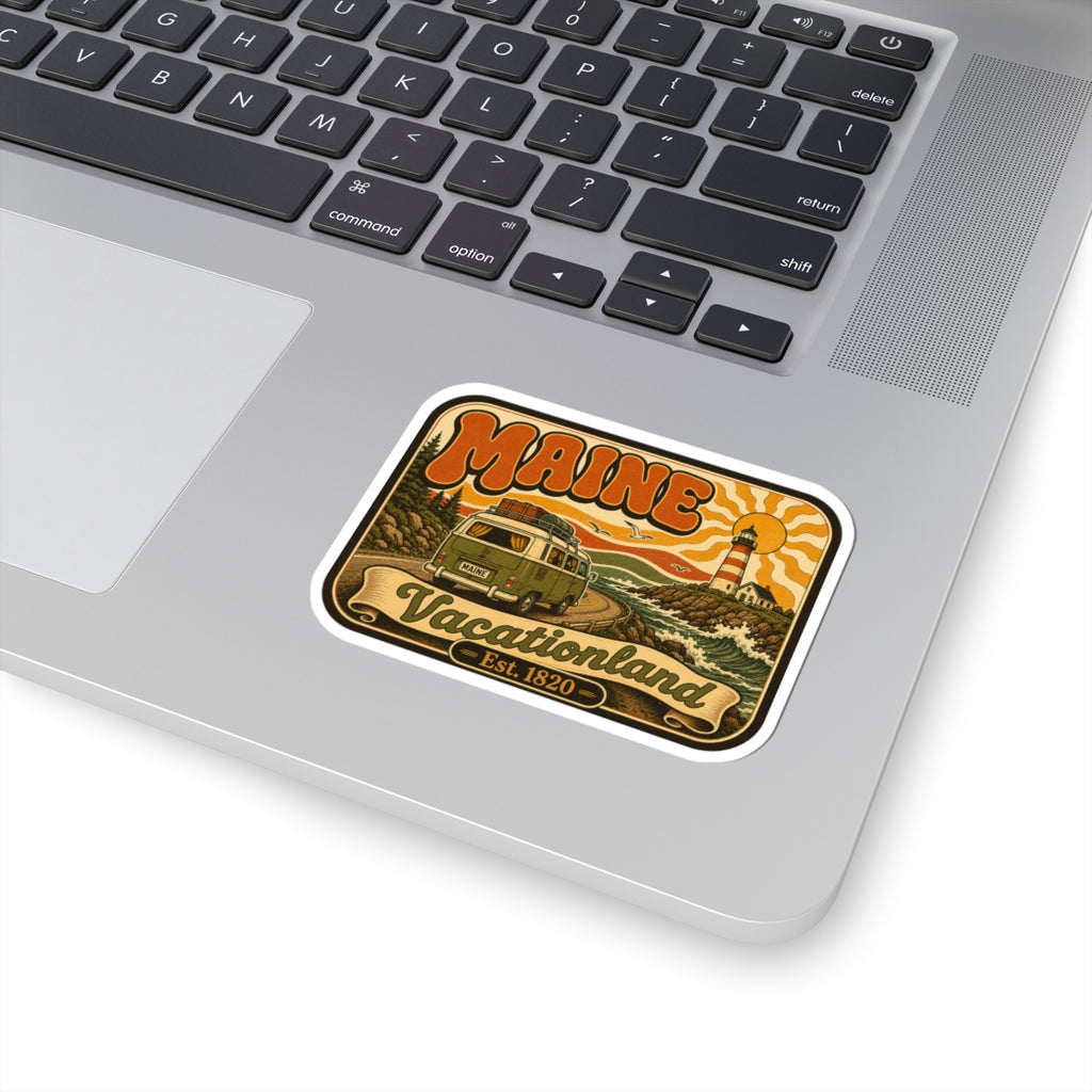 Kiss-cut retro camper roadtrip sticker on laptop, white border with lighthouse and scenic landscape