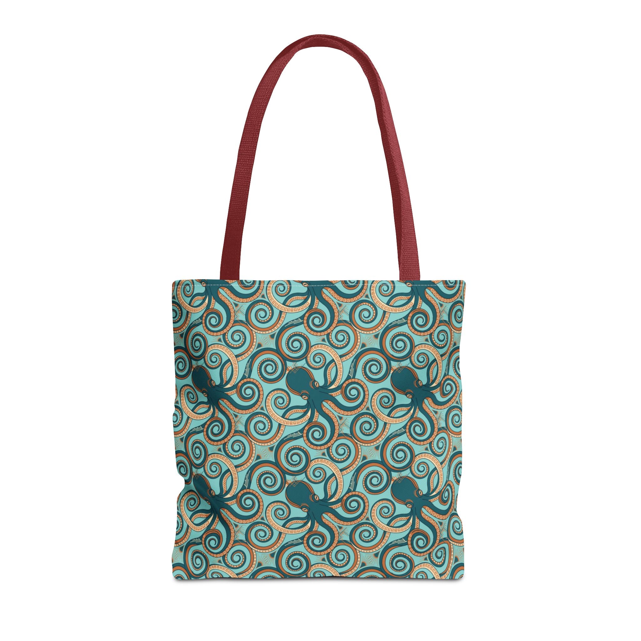 Teal tote bag with all-over octopus swirl pattern and red handles
