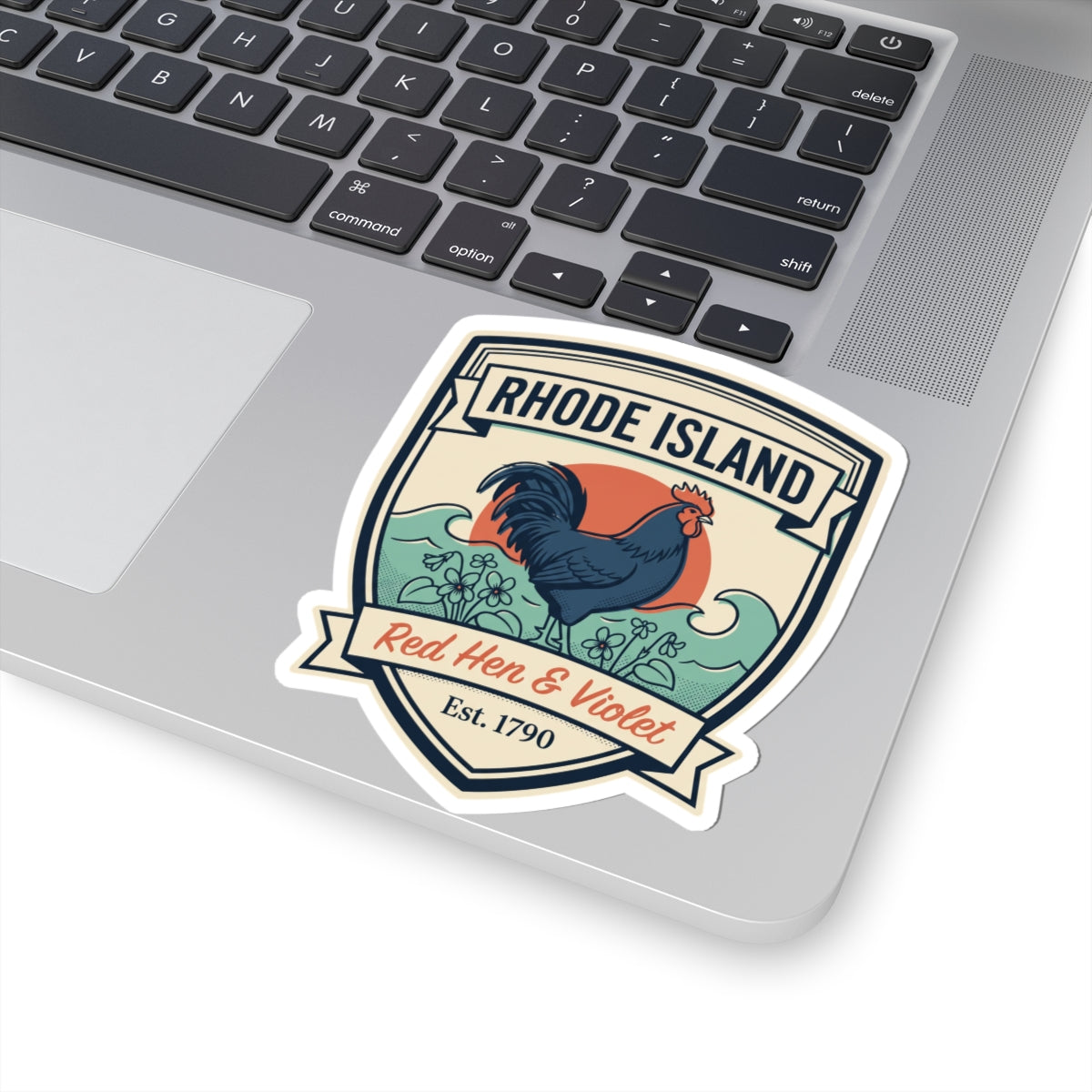 Rhode Island badge sticker on laptop screen edge