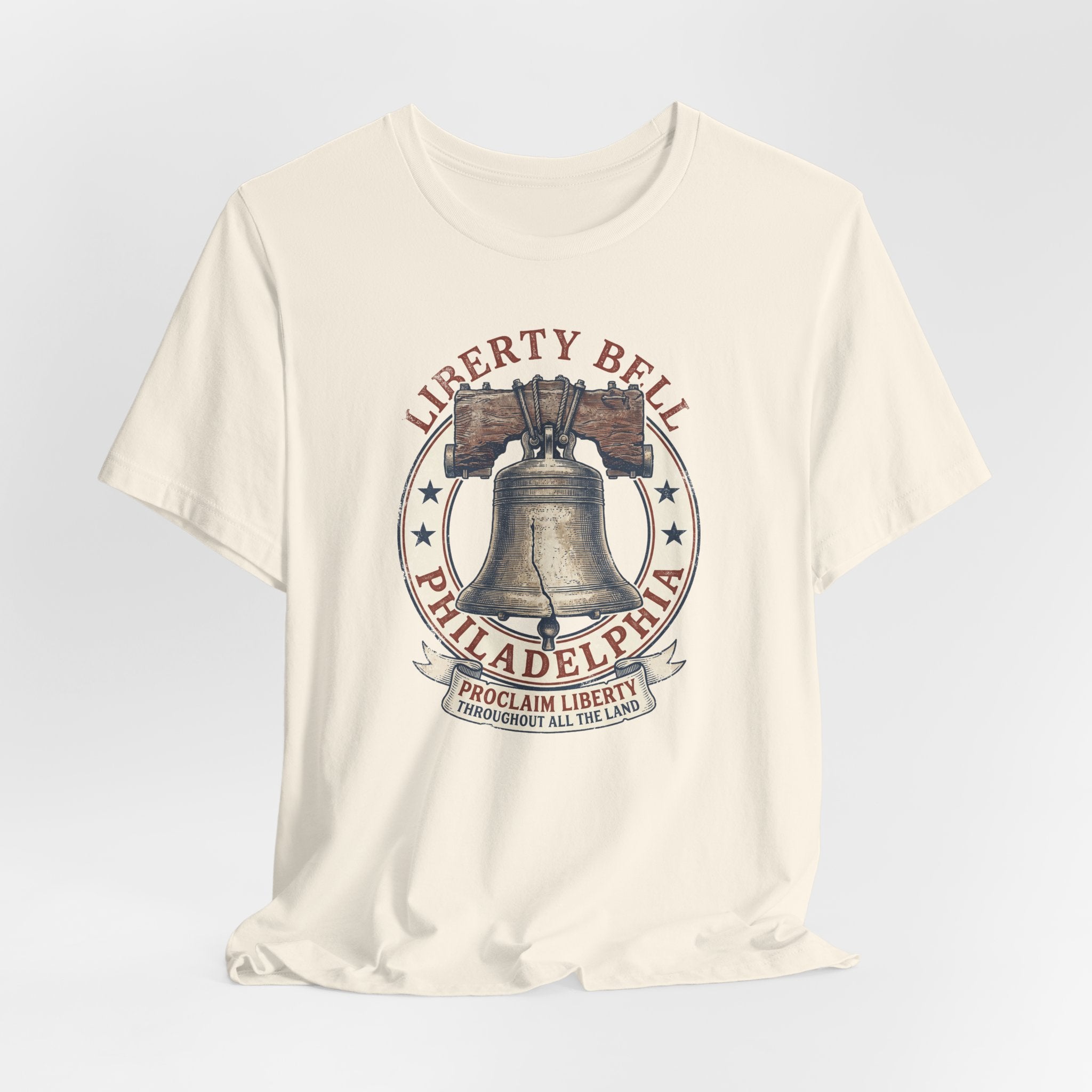 Cream crewneck T-shirt with centered Liberty Bell and text graphic