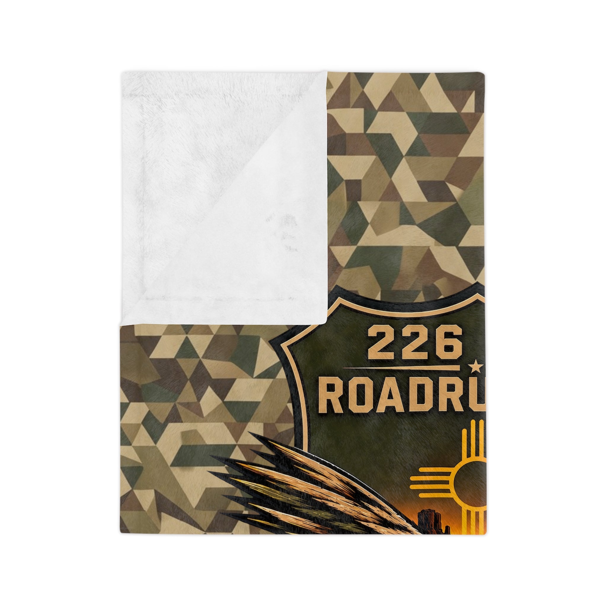 Folded camo microfiber blanket corner showing “226 ROADR…” patch and golden emblem