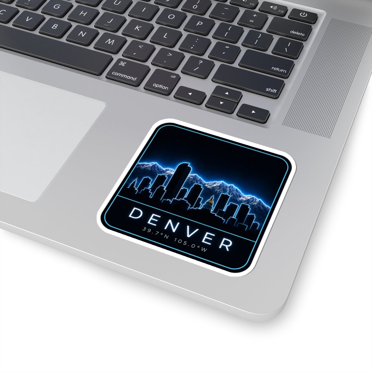 Rounded-square Denver sticker with neon blue skyline, DENVER text and 39.7N 105.0W