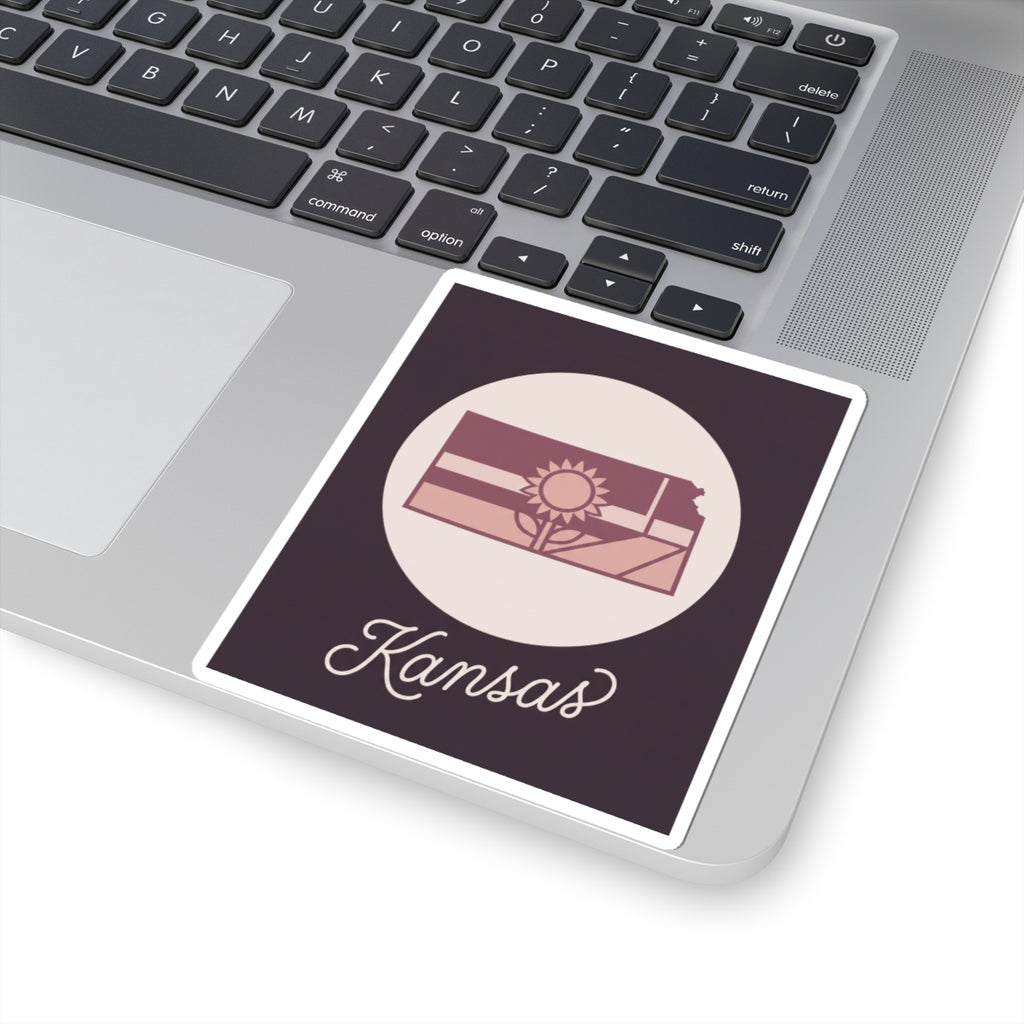 Kansas mauve vinyl decal sticker showing state silhouette, sun icon, and “Kansas” script
