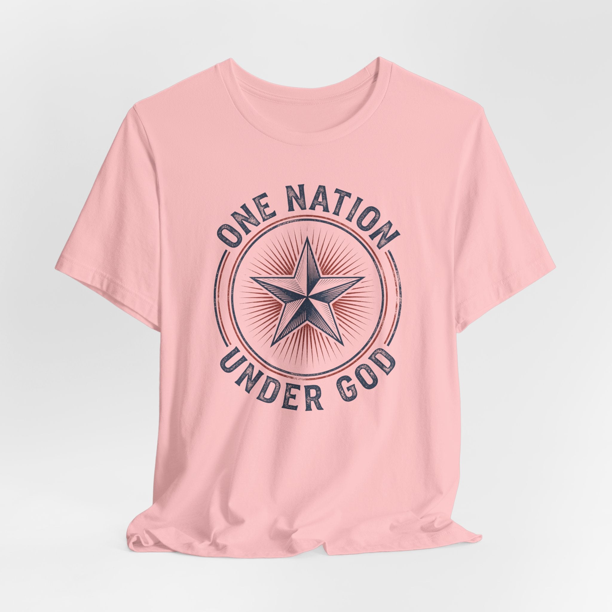 Peach graphic T-shirt with star emblem and arched 'ONE NATION UNDER GOD' text