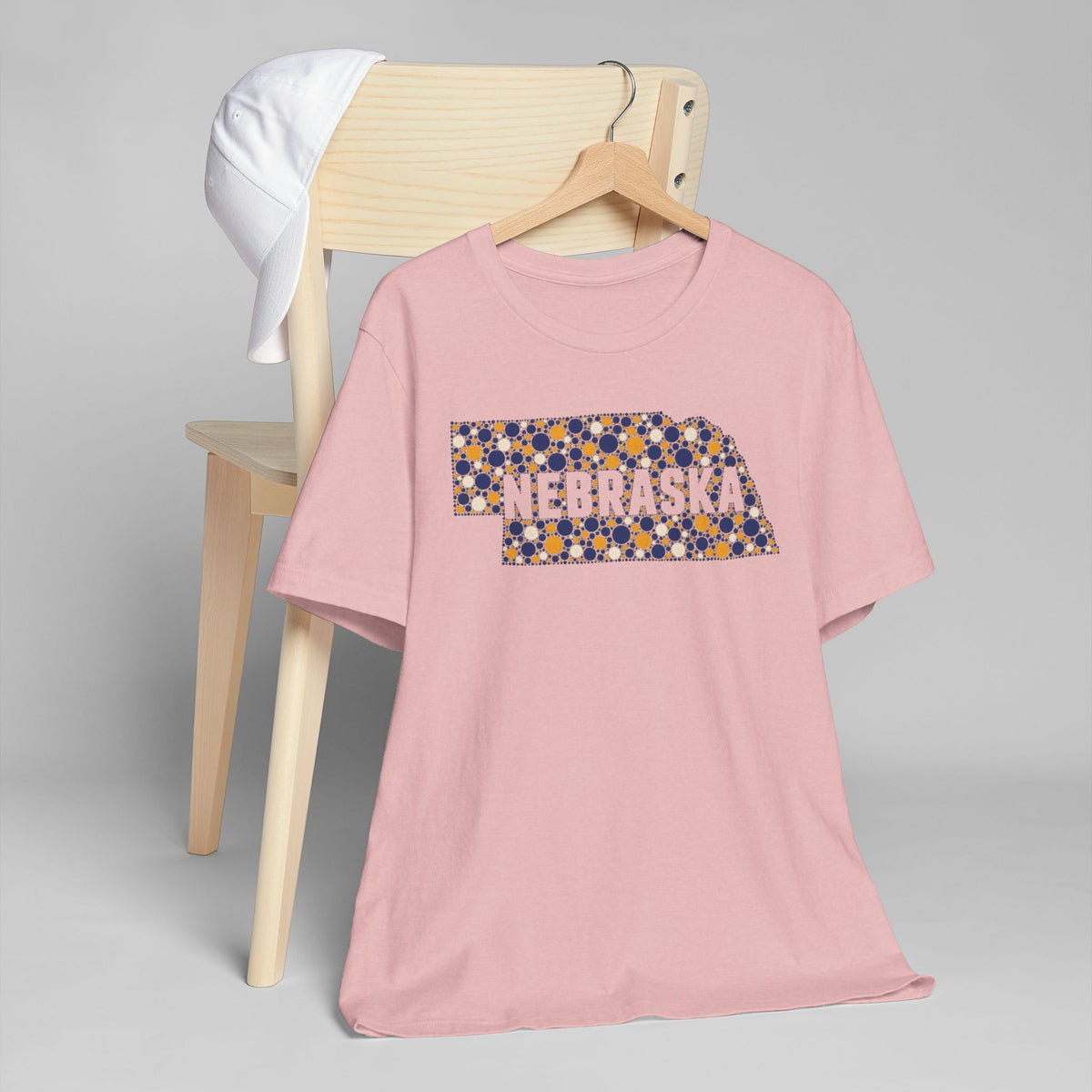 Pink crewneck t-shirt with colorful Nebraska map floral graphic