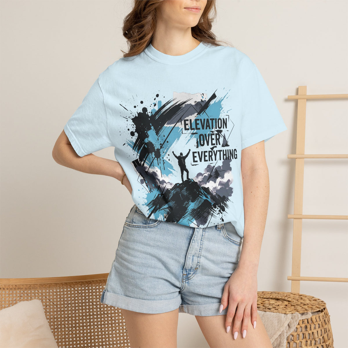 Light blue graphic mountain climber T-shirt with black splatter print on front