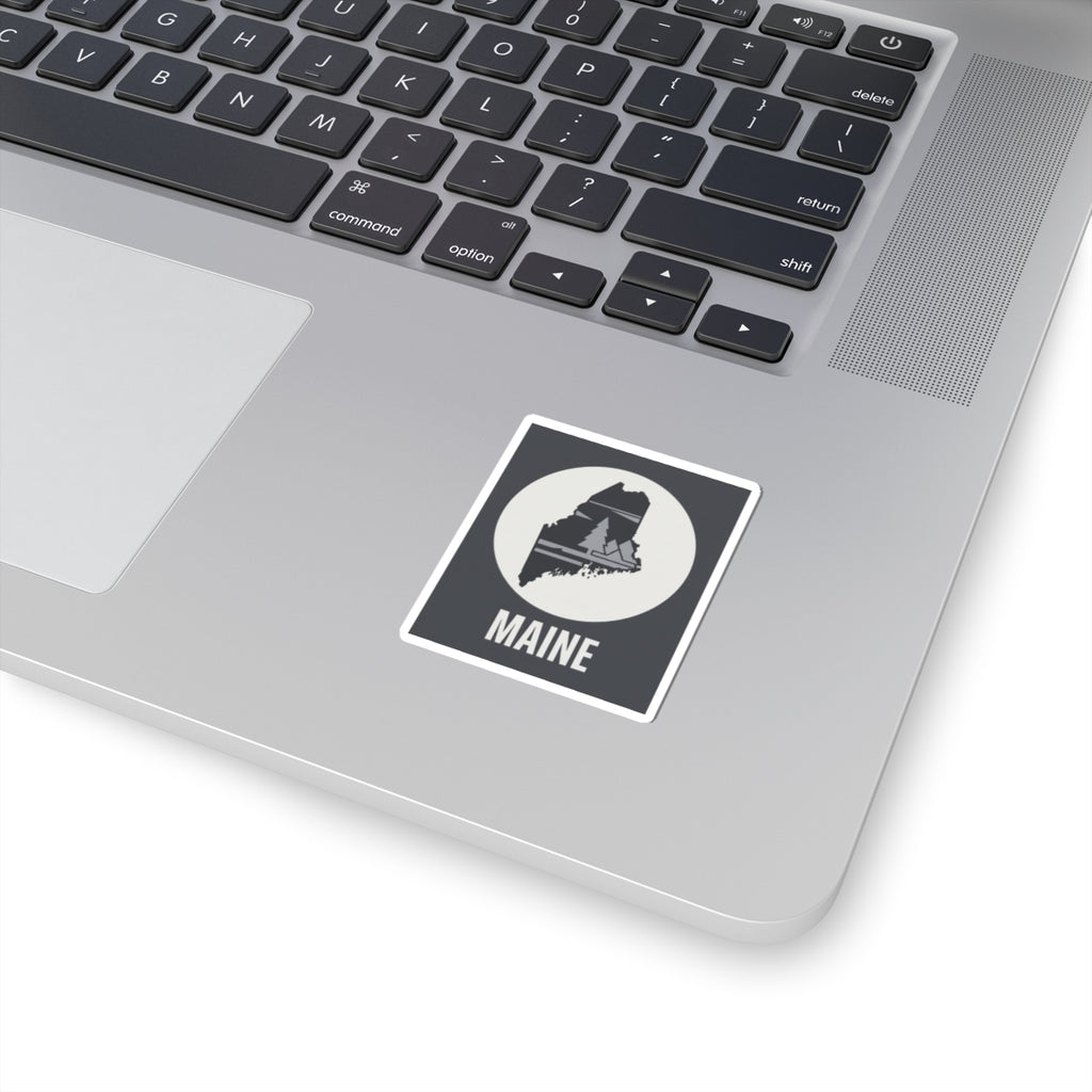 Maine state silhouette sticker with Maine text on a laptop