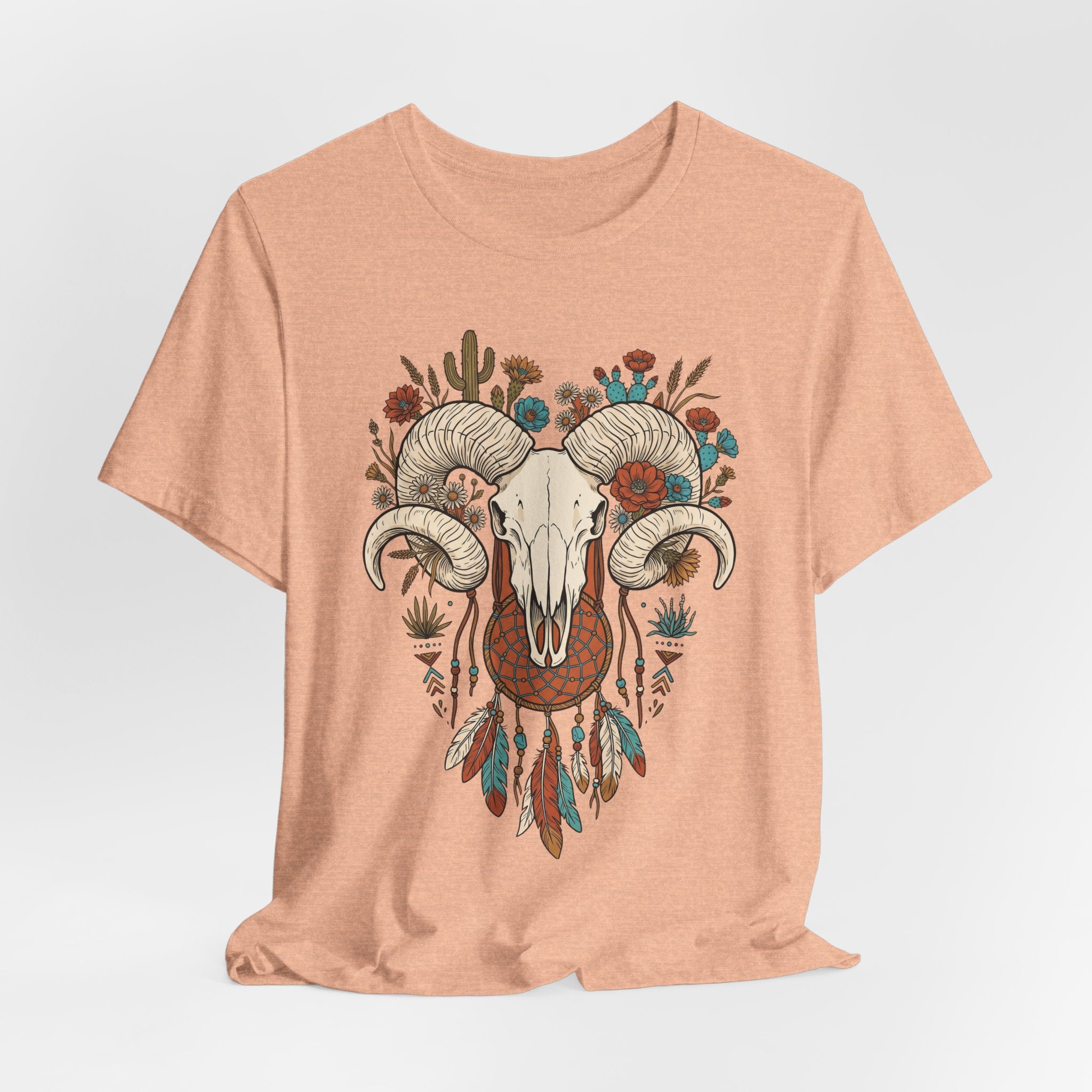 Peach front graphic ram skull with curled horns, flowers and dreamcatcher feathers