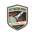 Destination Moon rocket sticker with orange flame trails and “Next Stop, Luna” script
