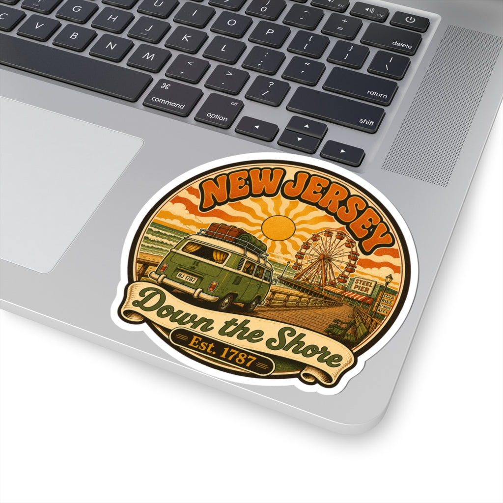 Round sticker on a laptop keyboard, featuring New Jersey text and Down the Shore design.
