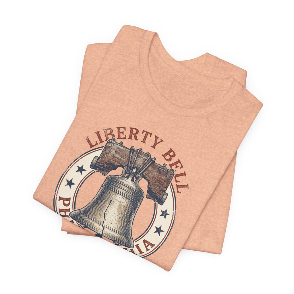 Peach Liberty Bell graphic T-shirt with bell and circular Philadelphia emblem