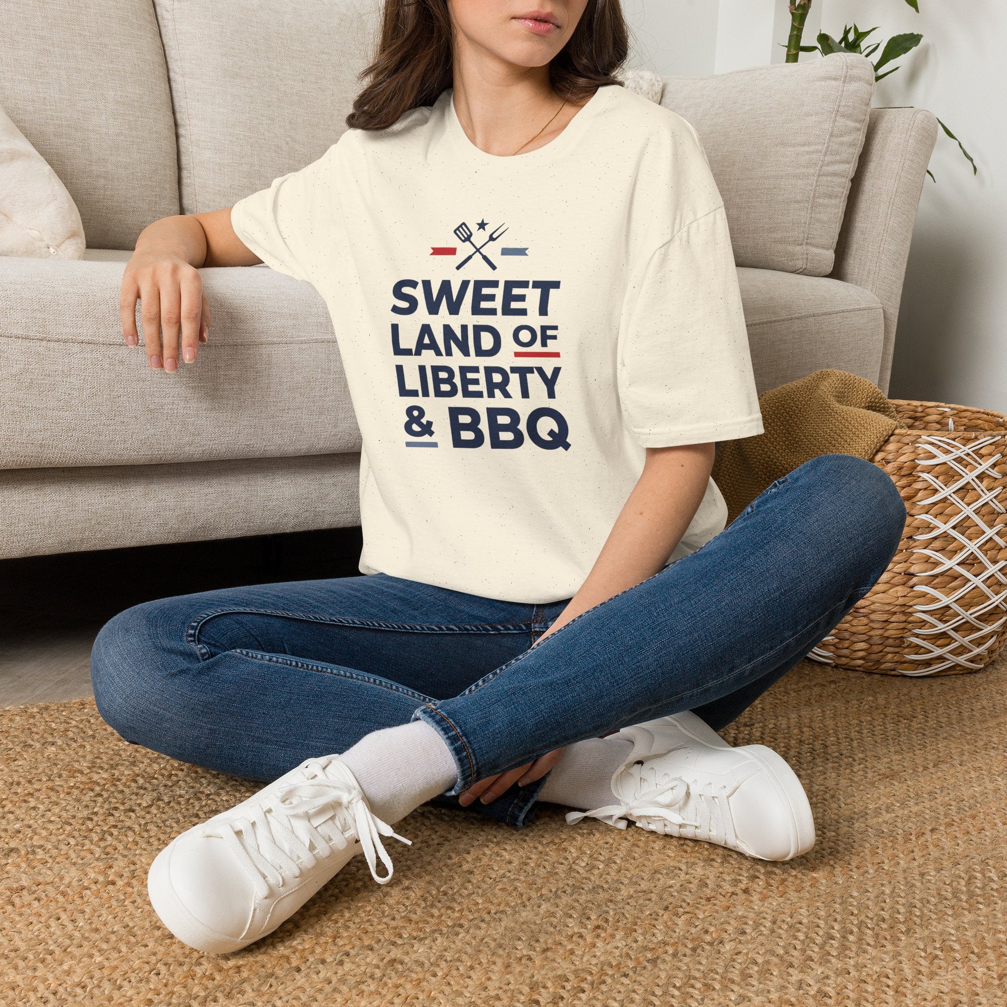Cream T-shirt with “Sweet Land of Liberty & BBQ” graphic on the front.