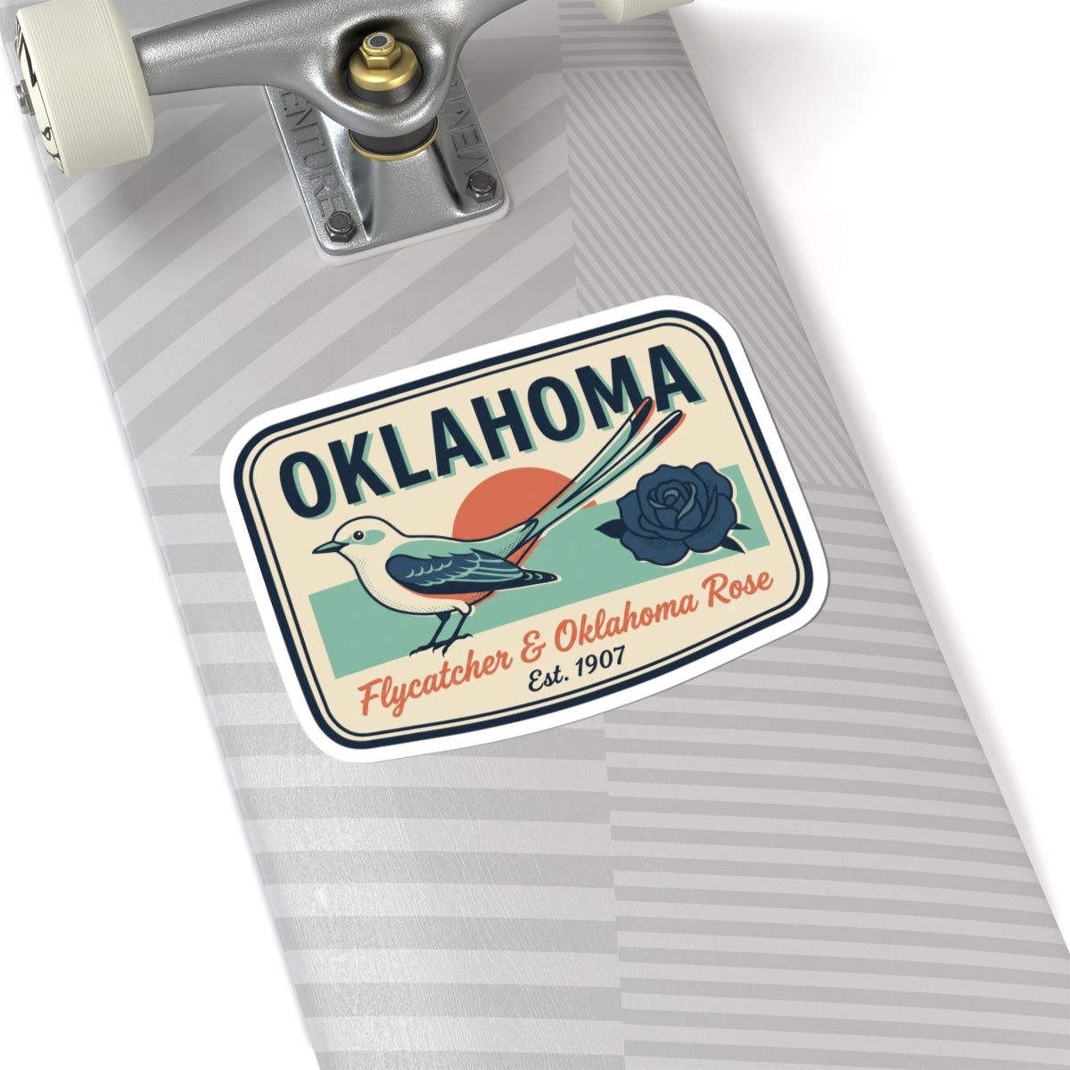 Oklahoma sticker on gray striped surface, bird and rose badge with white border