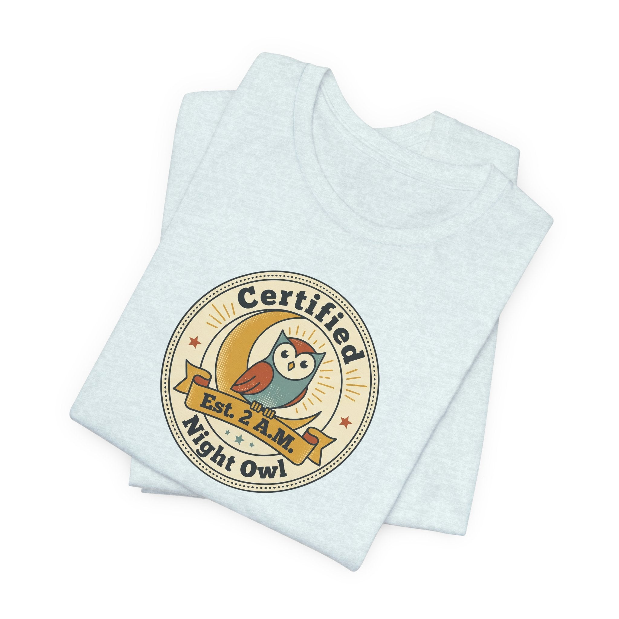 Light blue T-shirt with Certified Night Owl circular badge graphic front